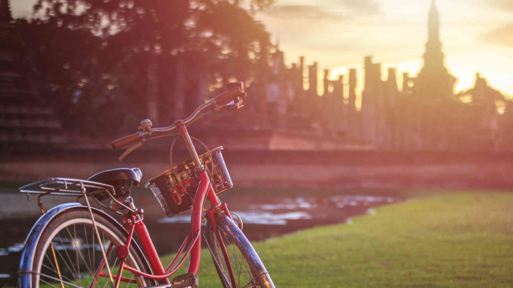 Vintage bicycle in Sukhothai Historical Park at Sunset time - Sukhothai