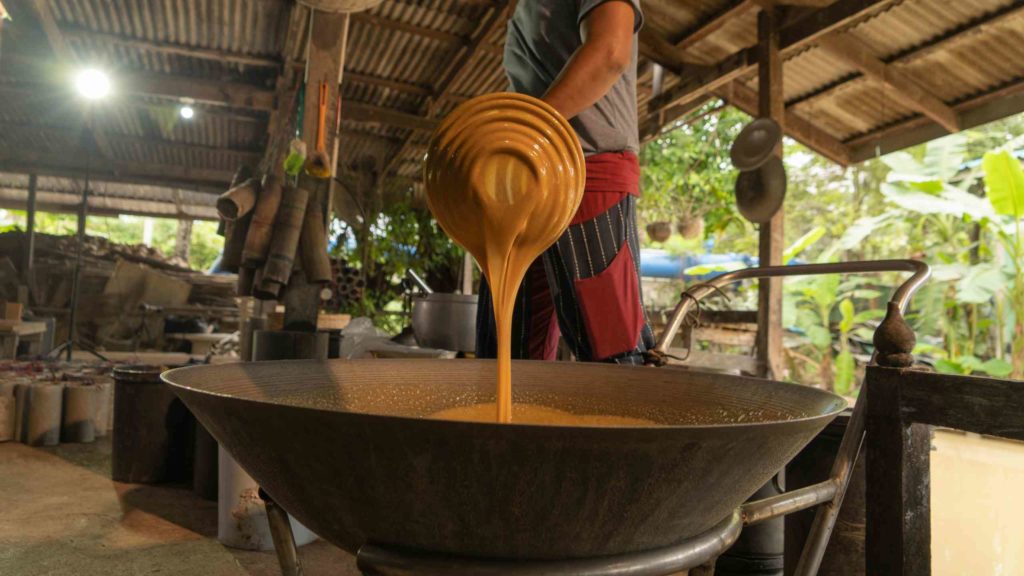 making boiled palm coconut sugar Floating market