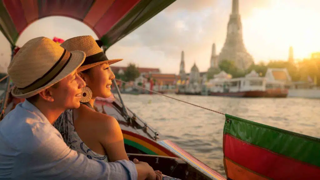 Couple traveller with boat in the Arun temple