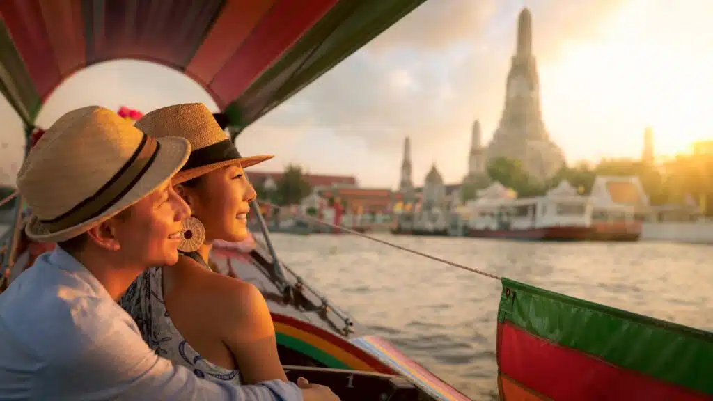 Couple traveller with boat in the Arun temple